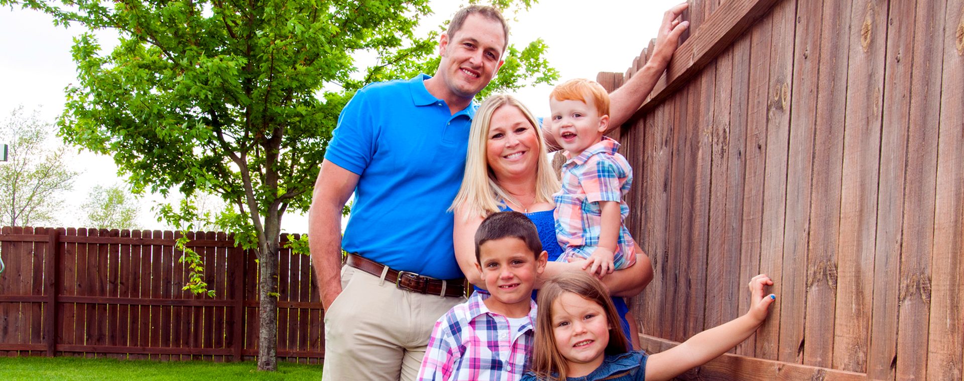A Wisconsin family at their farm fence
